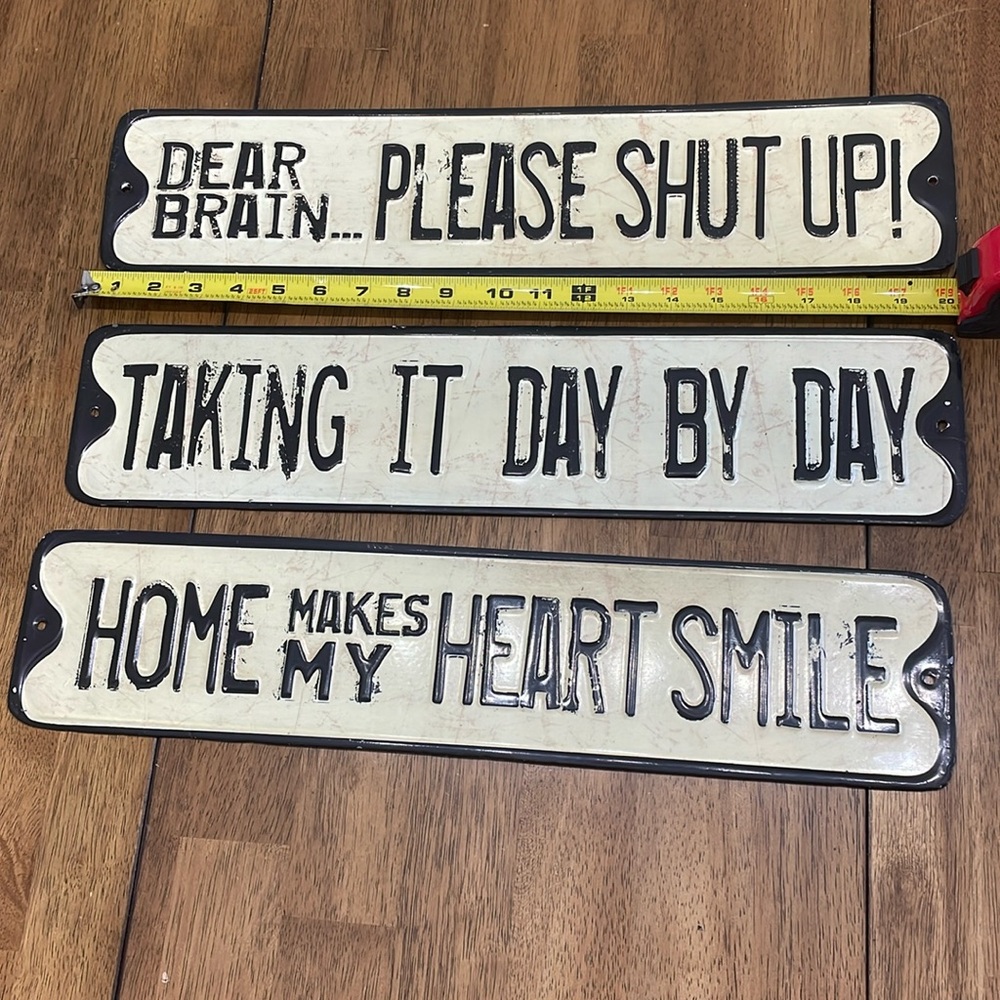 Three decorative signs in cream/tan and black. About 20 and 1/4 inches long.